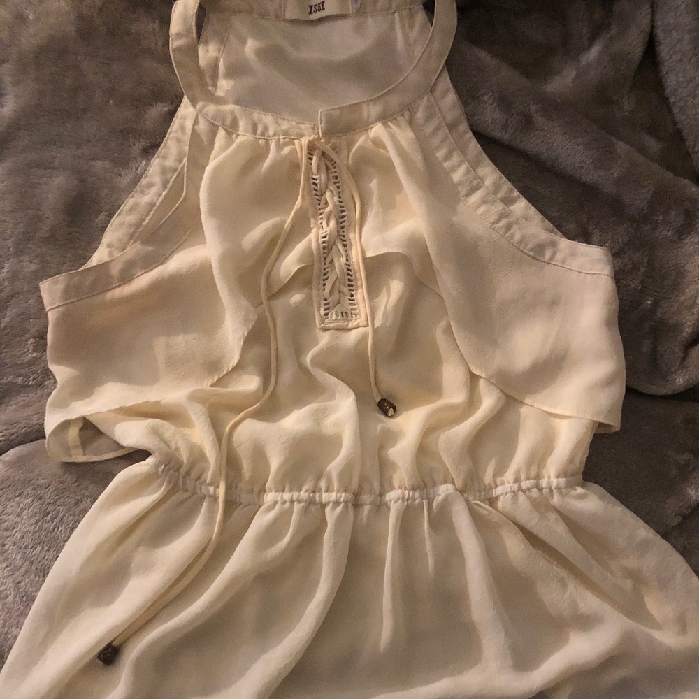 Cream sleeveless shirt